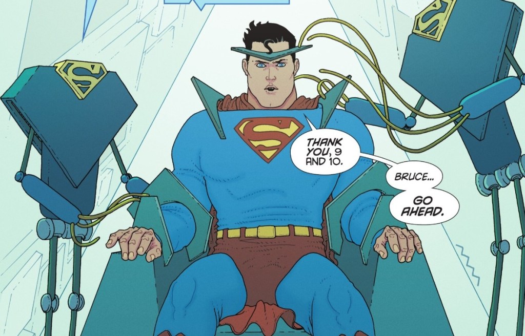 Superman is strapped to a chair, waiting to have purple kyptonite tested on him as he is attended to by robots